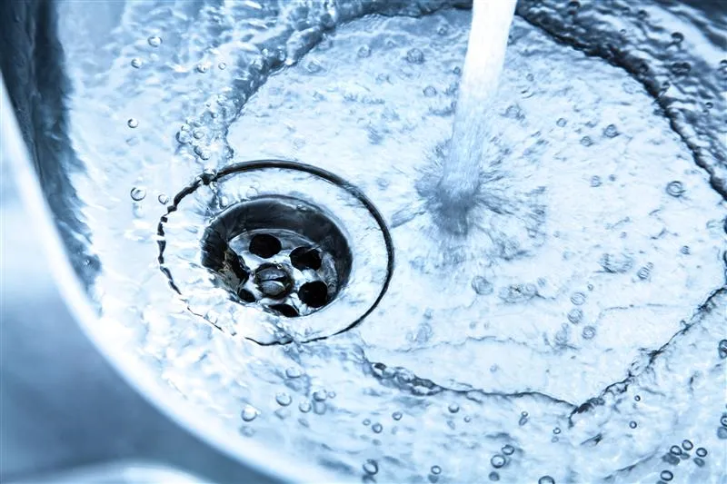 Kitchen faucet over a stainless steel sink